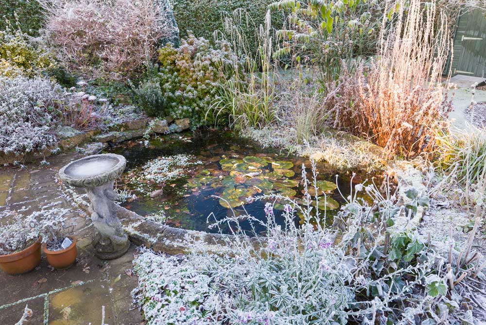 How do I prevent my pond freezing over?